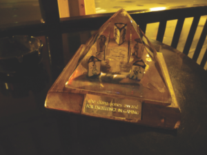 The Diana Jones Award, a lucite pyramid containing the burned remains of an Indiana Jones roleplaying game